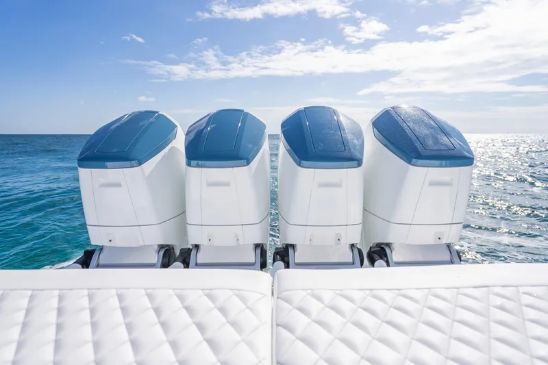 Slide: The Image of 2026 HCB 53 Suenos RXV boat with four powerful outboard engines on open sea. - 31