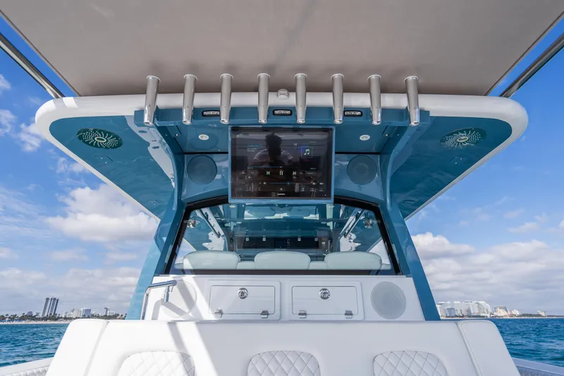 Slide: The Image of 2026 HCB 53 Suenos RXV boat interior with modern dashboard and ocean view. - 32