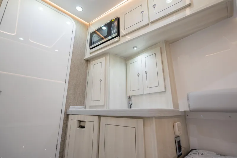 Slide: The Image of Modern interior of 2026 HCB 53 Suenos RXV with sleek cabinetry and built-in microwave. - 37