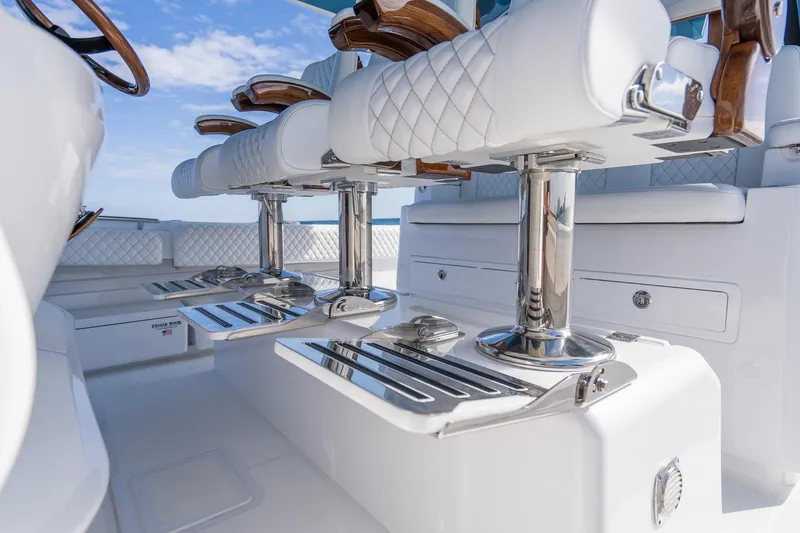 Slide: The Image of Luxurious seating on 2026 HCB 53 Suenos RXV boat, featuring elegant white upholstery and chrome accents. - 42
