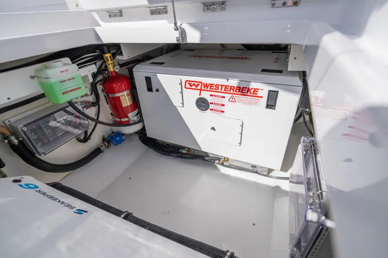 Slide: The Image of Engine room of 2026 HCB 53 Suenos RXV with Westerbeke generator and safety equipment. - 45