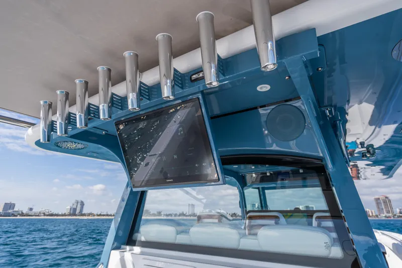 Slide: The Image of HCB 53 Suenos RXV 2026 boat with rod holders and navigation screen. - 5