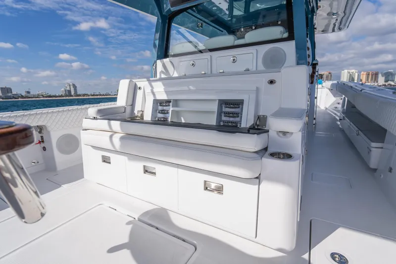 Slide: The Image of 2026 HCB 53 Suenos RXV luxury boat interior with white seating and ocean view. - 6