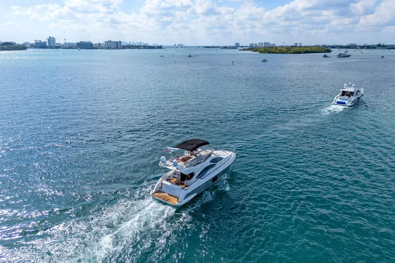 Slide: The Image of Azimut 45 Flybridge 2013 yacht cruising on a sunny day in open waters. - 13