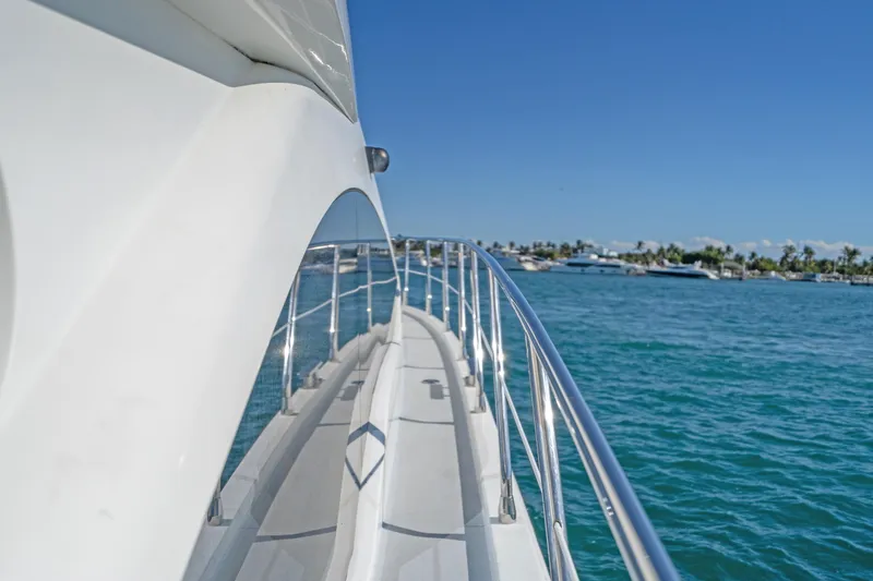 Slide: The Image of Side view of 2013 Azimut 45 Flybridge yacht on clear blue water. - 14