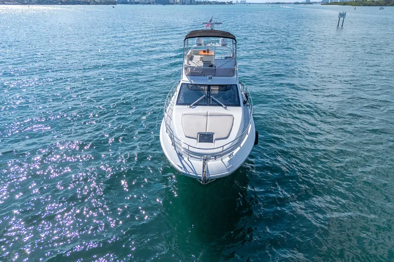 Slide: The Image of 2013 Azimut 45 Flybridge yacht on serene blue waters, aerial view. - 2