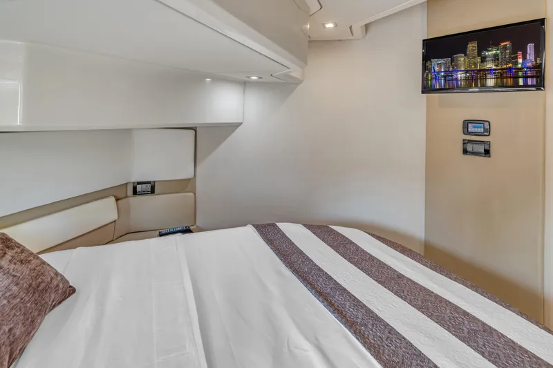 Slide: The Image of Luxurious bedroom interior of 2013 Azimut 45 Flybridge yacht with modern decor and wall-mounted TV. - 26