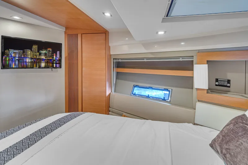 Slide: The Image of Luxurious interior of 2013 Azimut 45 Flybridge yacht with modern decor and cityscape artwork. - 28