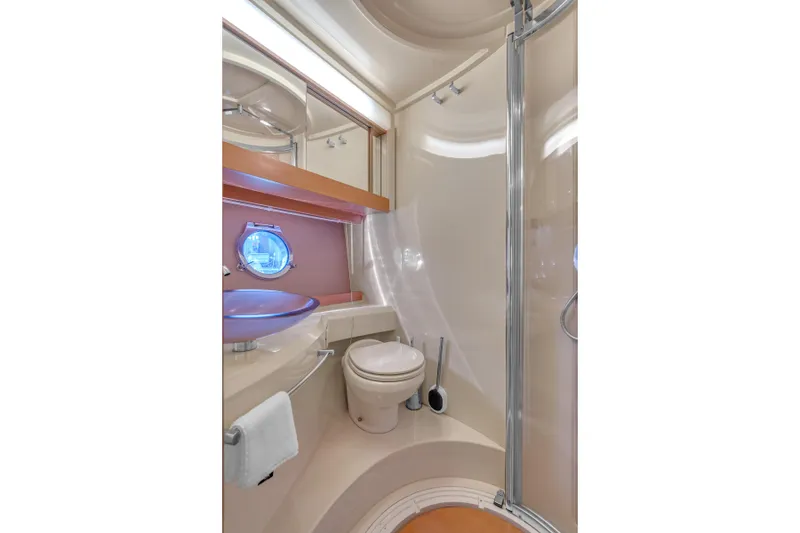 Slide: The Image of Luxurious bathroom in 2013 Azimut 45 Flybridge yacht with modern fixtures and porthole window. - 30