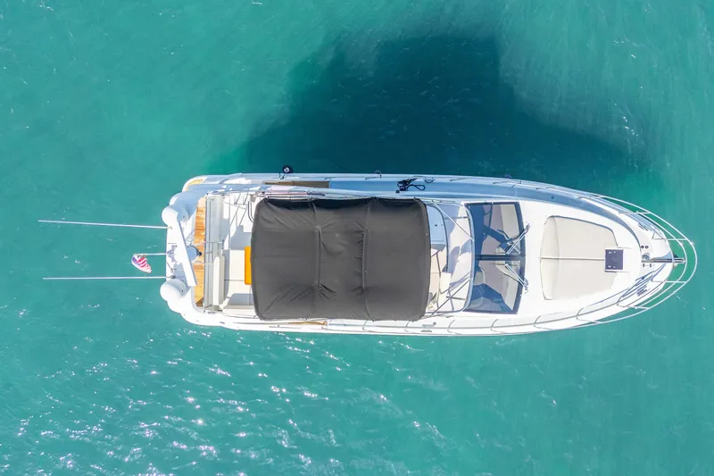 Slide: The Image of Overhead view of 2013 Azimut 45 Flybridge yacht on turquoise water. - 5