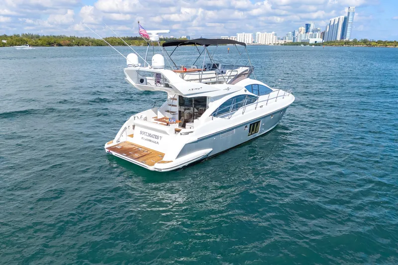 Slide: The Image of Azimut 45 Flybridge 2013 yacht cruising on blue waters near city skyline. - 8