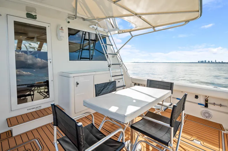 Slide: The Image of Tiara Yachts 4300 Convertible 2000 model, featuring a spacious deck with ocean view. - 43