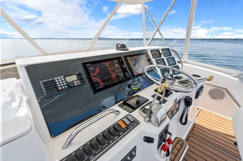 Slide: The Image of Cockpit of 2000 Tiara Yachts 4300 Convertible with navigation equipment and steering wheel. - 47