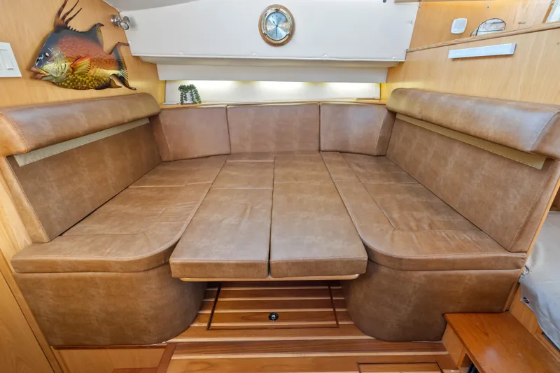 Slide: The Image of Luxurious interior of 2000 Tiara Yachts 4300 Convertible with plush seating and nautical decor. - 57