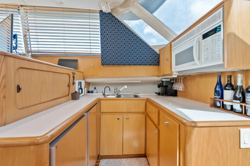 Slide: The Image of Luxurious kitchen interior of 2000 Tiara Yachts 4300 Convertible with modern amenities. - 59