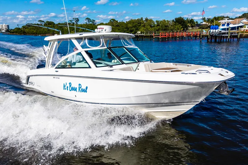 The Image of 2019 Boston Whaler 320 Vantage boat on water under clear blue sky. - 0