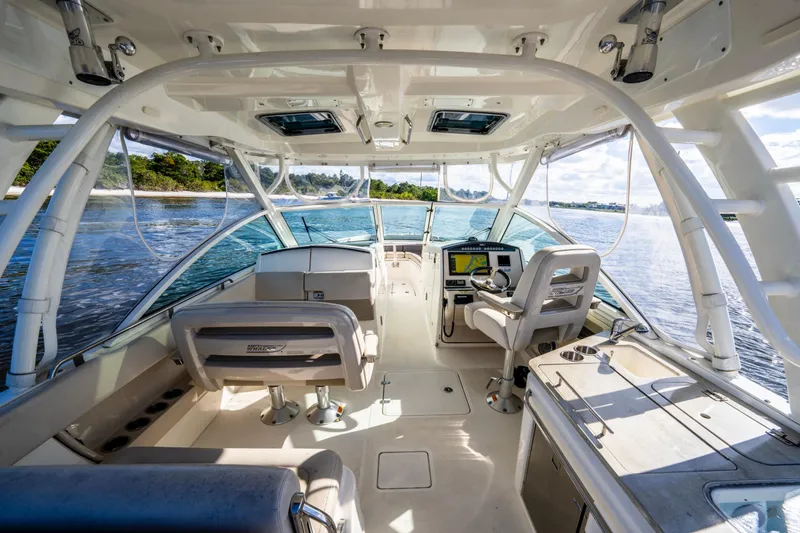 Slide: The Image of Interior view of 2019 Boston Whaler 320 Vantage boat, featuring helm and seating area. - 25