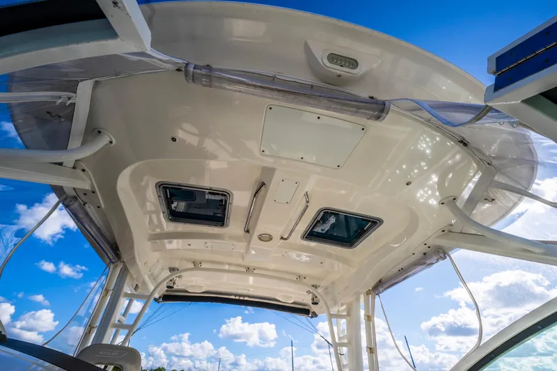 Slide: The Image of 2019 Boston Whaler 320 Vantage boat roof with clear sky background. - 30