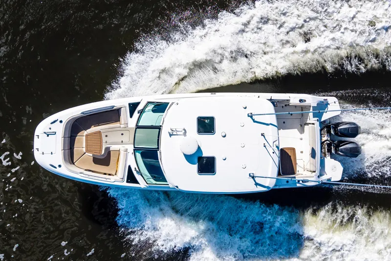 Slide: The Image of Aerial view of 2019 Boston Whaler 320 Vantage cruising on water. - 5