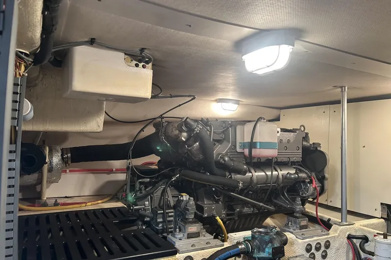 Slide: The Image of Engine room of 2008 Mainship 34 Trawler, featuring well-maintained mechanical components. - 31
