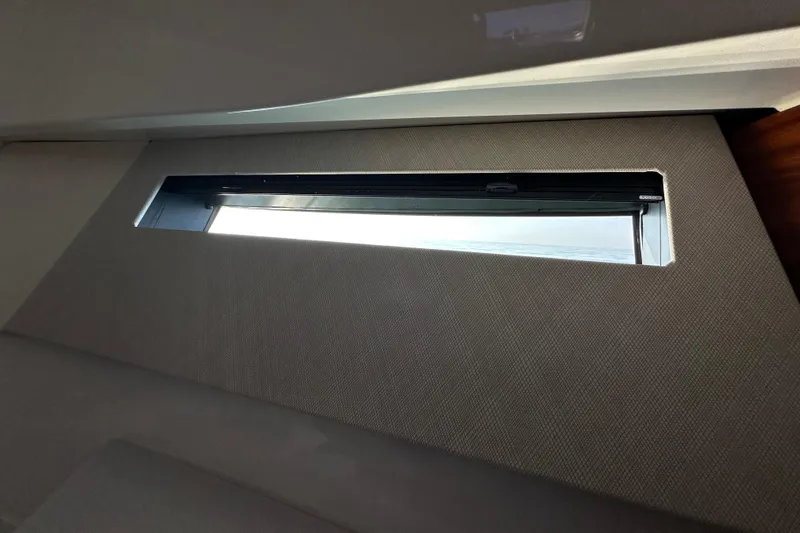 Slide: The Image of 2024 Pursuit OS 445 Offshore cabin window with sleek interior design. - 31
