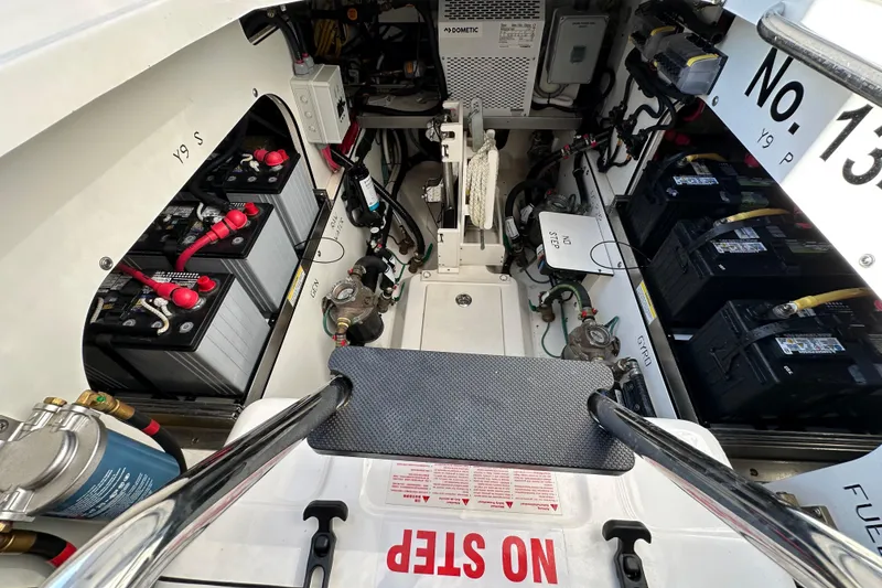 Slide: The Image of 2024 Pursuit OS 445 Offshore engine compartment with batteries and equipment. - 46