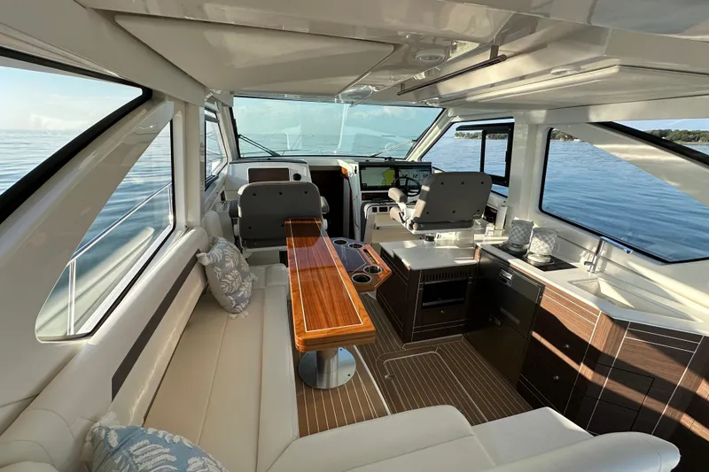 Slide: The Image of Luxurious interior of 2024 Pursuit OS 445 Offshore yacht with modern amenities and scenic ocean view. - 5