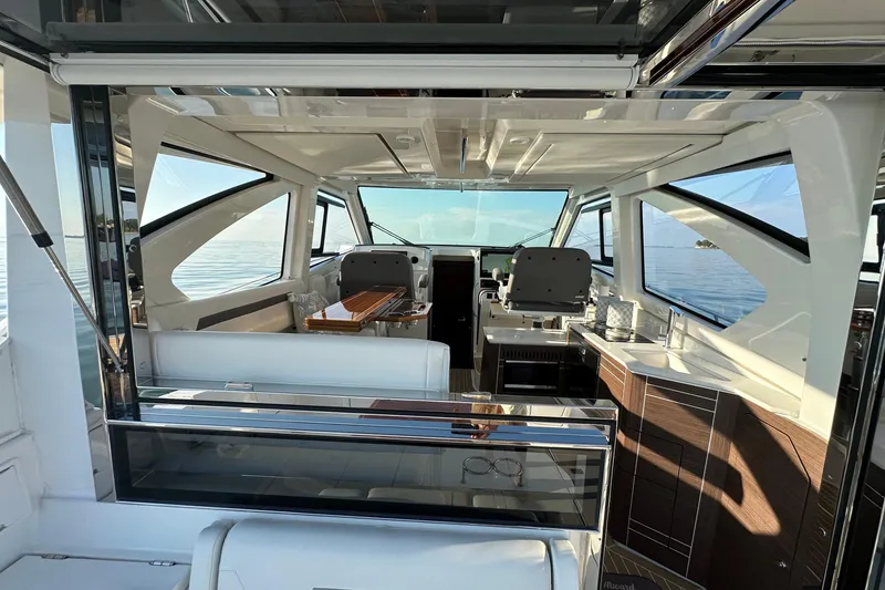 Slide: The Image of Luxurious interior of 2024 Pursuit OS 445 Offshore yacht with modern design and ocean view. - 6