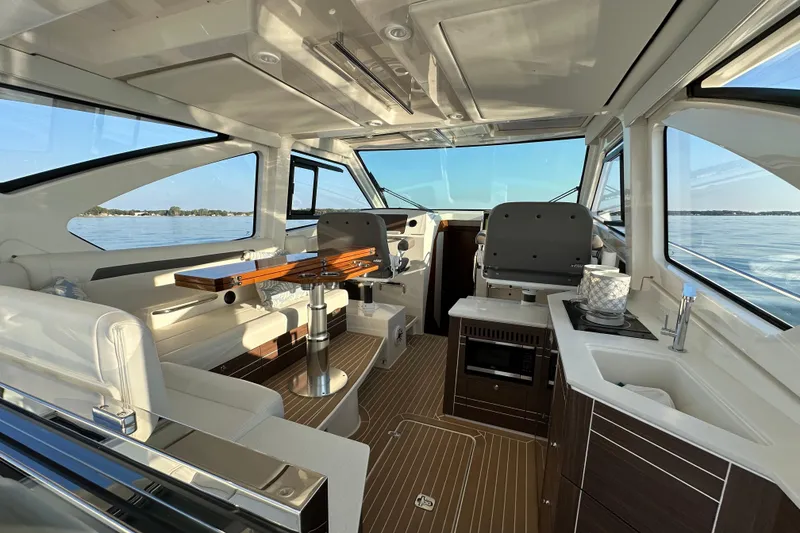 Slide: The Image of Luxurious interior of 2024 Pursuit OS 445 Offshore yacht with modern amenities and scenic views. - 7