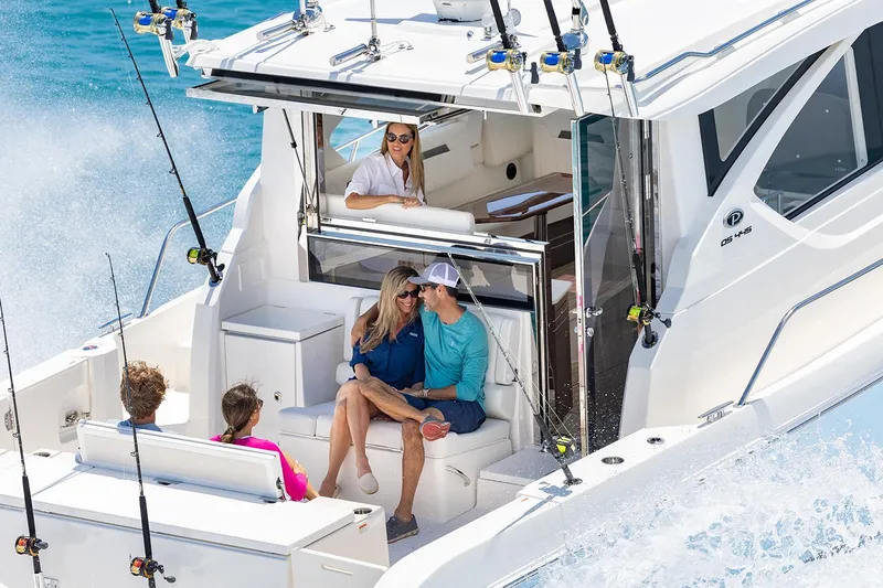Slide: The Image of Manufacturer Provided Image: 2024 Pursuit OS 445 Offshore boat with people enjoying a day on the water. - 73