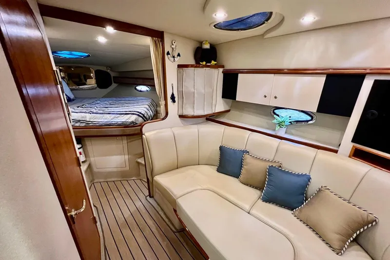 Slide: The Image of 2003 Cruisers Yachts 3470 Express interior with cozy seating and elegant decor. - 25