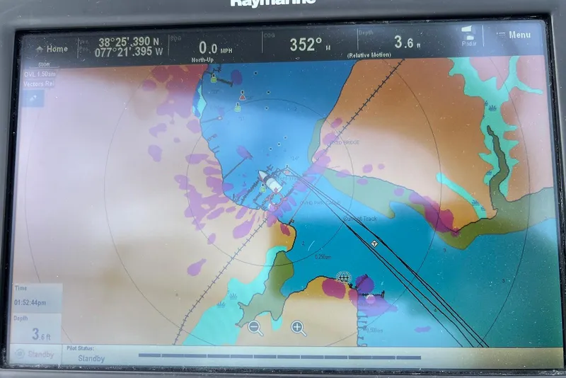 Slide: The Image of Navigation display on a 2003 Cruisers Yachts 3470 Express showing map and coordinates. - 14