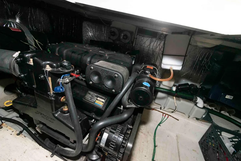 Slide: The Image of Engine room of 1999 Cruisers Yachts 3750 Motoryacht, showcasing detailed mechanical components. - 17