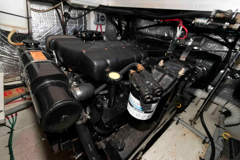 Slide: The Image of Engine room of 1999 Cruisers Yachts 3750 Motoryacht, showcasing mechanical components. - 18
