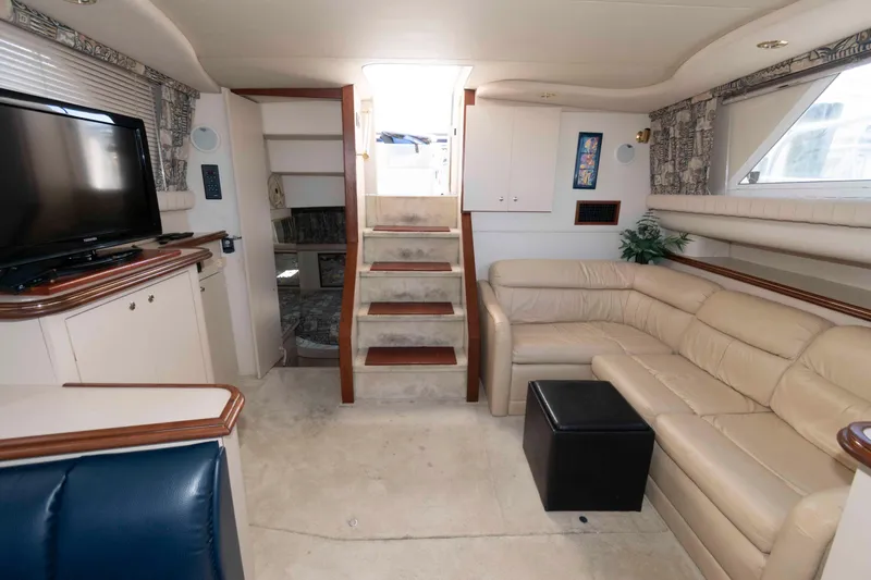 Slide: The Image of Luxurious interior of 1999 Cruisers Yachts 3750 Motoryacht with beige leather seating and TV. - 10