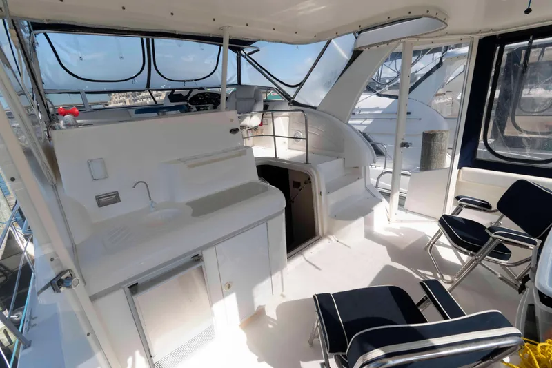 Slide: The Image of 1999 Cruisers Yachts 3750 Motoryacht interior with seating and helm station. - 3