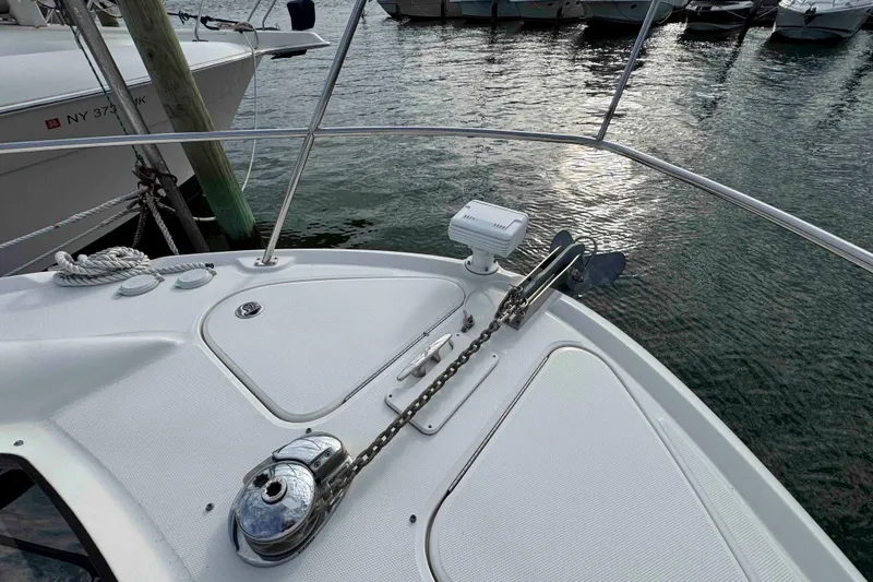 Slide: The Image of Bow of 2007 Sea Ray 40 Motor Yacht with anchor and winch, docked in marina. - 14