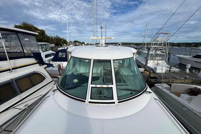 Slide: The Image of 2007 Sea Ray 40 Motor Yacht docked among other boats at a marina. - 15