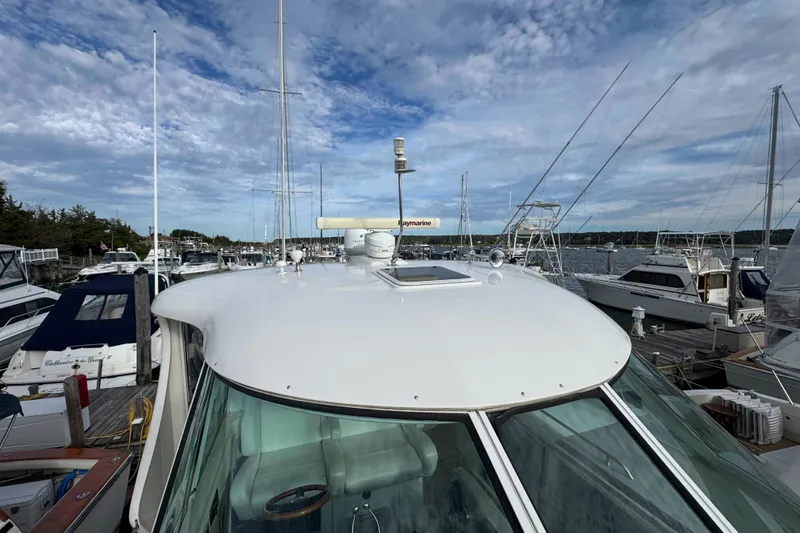 Slide: The Image of 2007 Sea Ray 40 Motor Yacht docked at marina under blue sky. - 17
