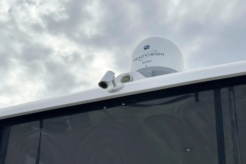 Slide: The Image of 2007 Sea Ray 40 Motor Yacht with TracVision satellite system under cloudy sky. - 19