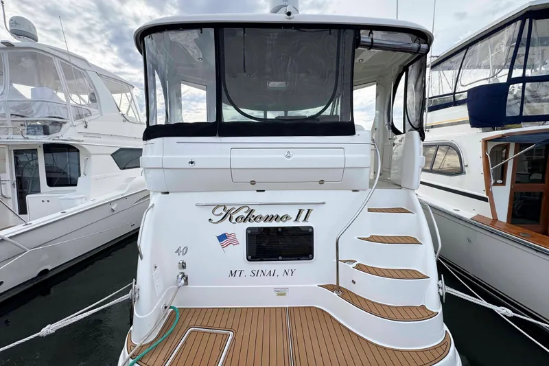 Slide: The Image of 2007 Sea Ray 40 Motor Yacht docked, featuring "Kokomo II" name and Mt. Sinai, NY location. - 2