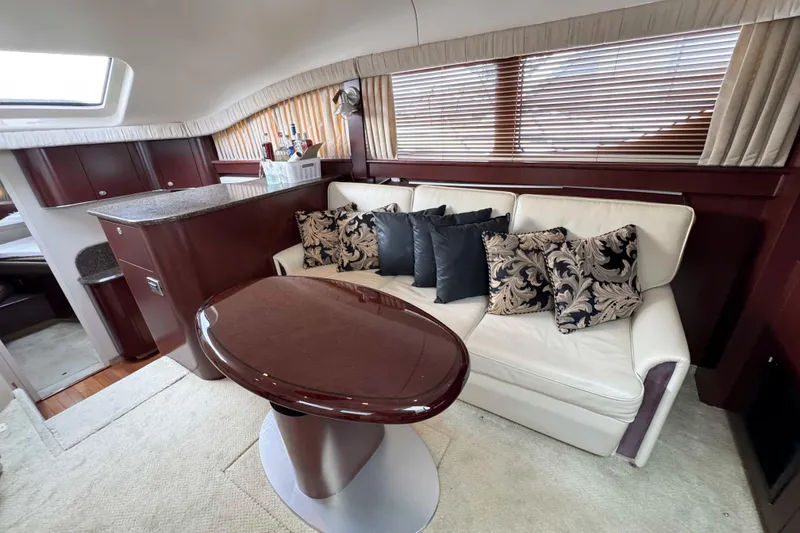 Slide: The Image of Luxurious interior of 2007 Sea Ray 40 Motor Yacht with elegant seating and wooden accents. - 21