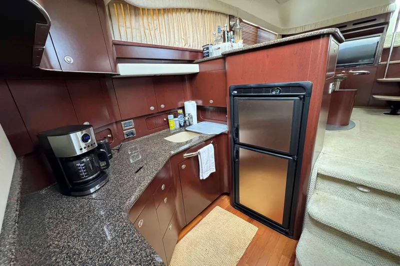 Slide: The Image of Luxurious 2007 Sea Ray 40 Motor Yacht kitchen with modern appliances and sleek cabinetry. - 25