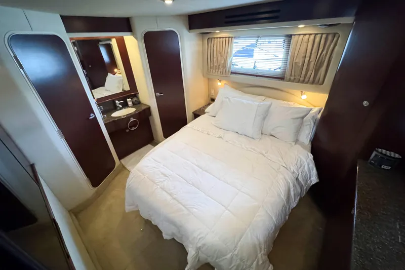 Slide: The Image of Luxurious bedroom interior of 2007 Sea Ray 40 Motor Yacht with cozy bedding. - 26