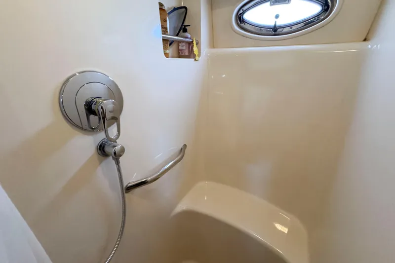 Slide: The Image of Shower area in 2007 Sea Ray 40 Motor Yacht with chrome fixtures and porthole window. - 29