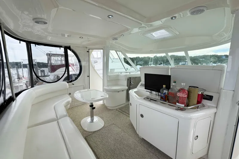 Slide: The Image of Luxurious interior of 2007 Sea Ray 40 Motor Yacht with seating and bar area. - 3