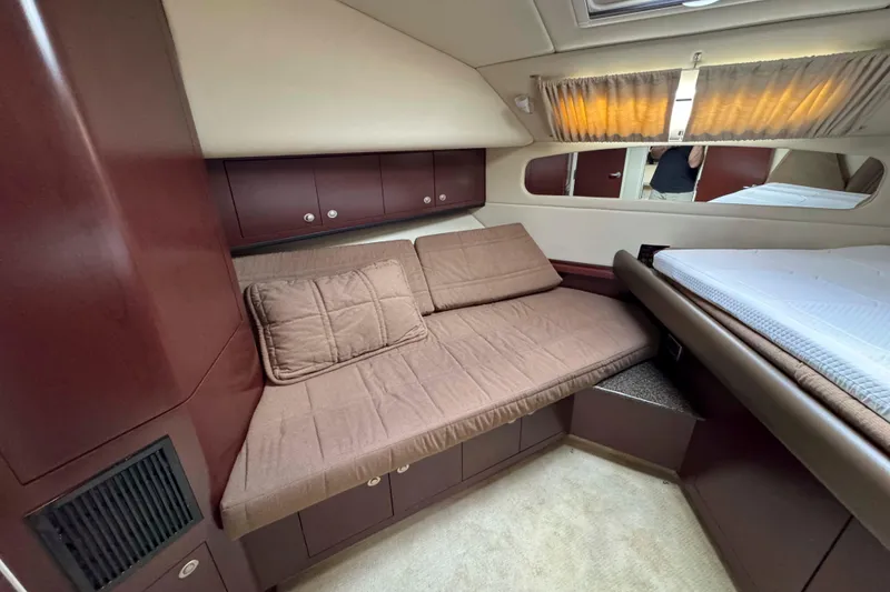 Slide: The Image of 2007 Sea Ray 40 Motor Yacht interior with cozy seating and elegant wood finish. - 33