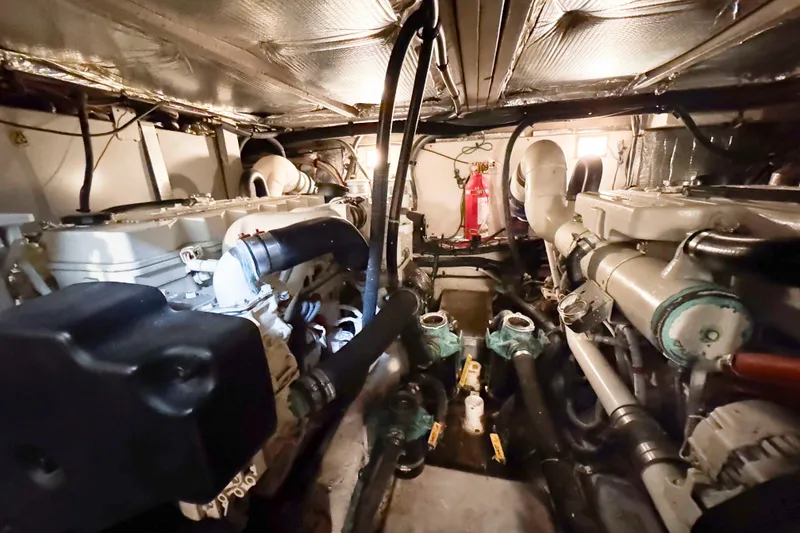 Slide: The Image of Engine room of a 2007 Sea Ray 40 Motor Yacht, featuring dual engines and fire extinguisher. - 36
