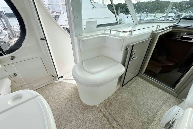 Slide: The Image of Interior of 2007 Sea Ray 40 Motor Yacht with white seating and open cabin door. - 5
