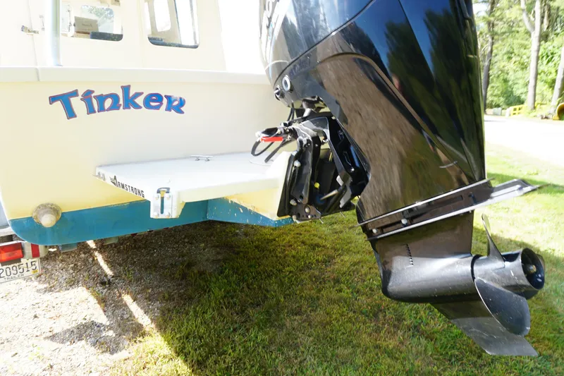 Slide: The Image of 2002 Rosborough RF-246 Sedan Cruiser with outboard motor, named "Tinker," - 10
